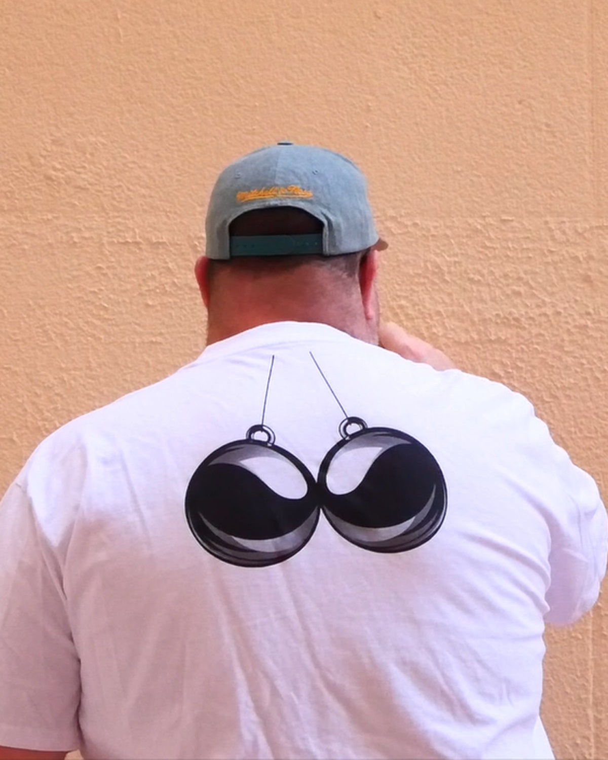BBA heavyweight oversized tee in Heavyweight White, back view with signature orb graphic